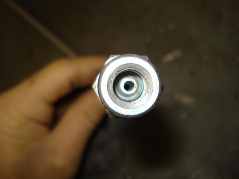 1979 Ford Bronco - Metal brake line fitting, likely for a vehicle's hydraulic system.