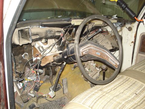 1979 Ford Bronco - The interior of a 1978 Ford Bronco reveals a disassembled dashboard with exposed wiring and controls.