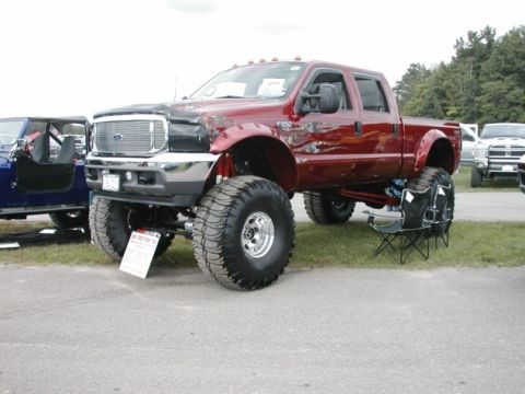 1994 Ford Bronco - This lifted pickup truck appears to be from the mid-2000s, not a 1994 model.