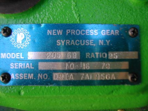 1979 Ford Bronco - Close-up of a New Process Gear identification plate, showing model and serial numbers.