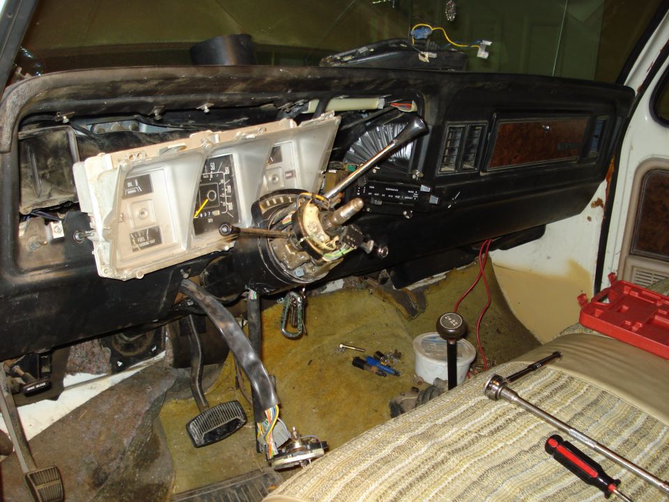 1970s Ford truck dash with gauge cluster pulled and steering wheel removed