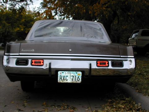 1971 Dodge Dart - Rear view of a 1971 Dodge Dart, its distinctive rectangular taillights and chrome bumper.