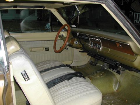 1971 Dodge Dart - The interior of a 1971 Dodge Dart shows its tan bench seats and dashboard details.