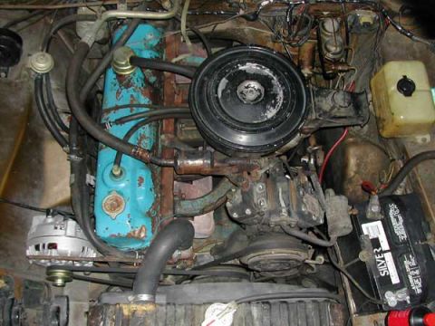 1971 Dodge Dart - Engine bay of a 1971 Dodge Dart, turquoise valve covers and a black air cleaner assembly.
