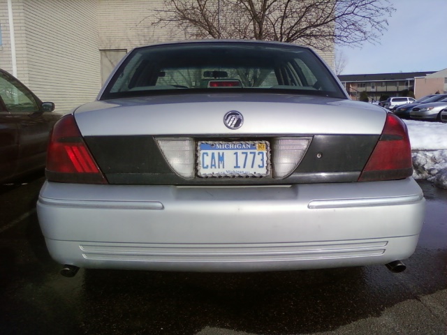 Rear of a silver Mercury Grand Marquis with Michigan plate