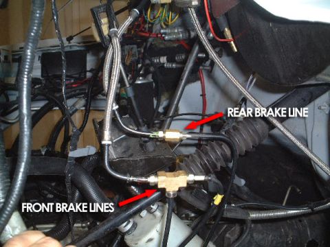 2007 Ford Mustang - Close-up view of front and rear brake lines with labels and red arrows indicating their paths.