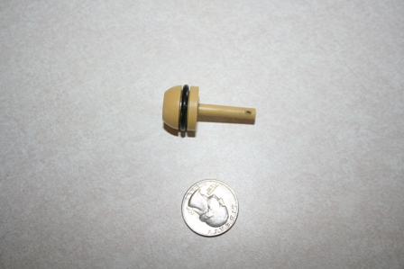 2007 Ford Mustang - A small automotive part is shown next to a quarter for size comparison.