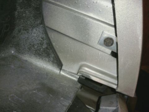 1996 Mercury Grand Marquis - A close-up view of a vehicle's internal component, showing a bolted bracket.
