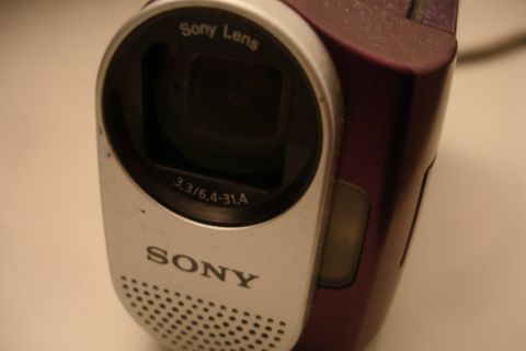 1993 Ford Taurus - Close-up of a purple Sony Handycam camcorder, showing the lens and branding.