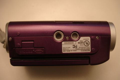 1993 Ford Taurus - This purple Sony MHS-CM1 digital camera features a PRO DUO slot and various ports on its side.