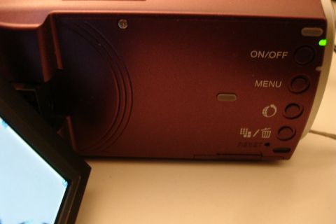 1993 Ford Taurus - Digital camcorder with control buttons visible, including power and menu options.