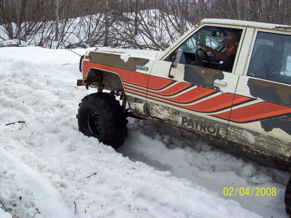 Nissan Patrol with "PATROL" text on the side, driving through snow. Date stamp reads 02/04/2008