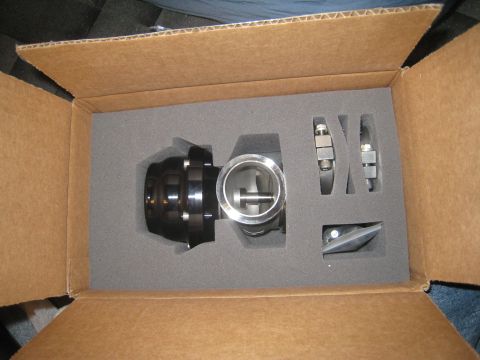 2007 Subaru Impreza - An external wastegate, a component for a vehicle's exhaust system, is shown packaged in a cardboard box.