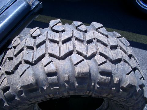 1979 Ford Bronco - The tread pattern on this off-road tire is designed for maximum grip on rough terrain.