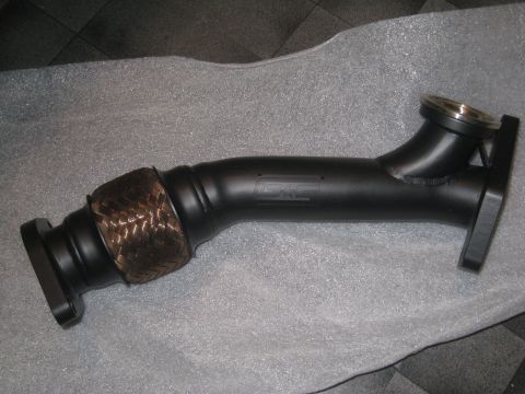 2007 Subaru Impreza - A black exhaust manifold part with braided flex pipe and flanges, bearing the "GRIMMSPEED" logo.
