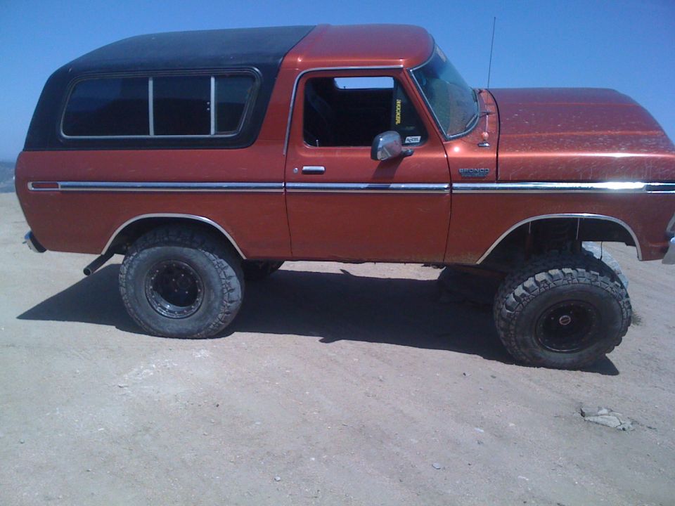 1978 Ford Bronco lifted with off-road tires, side view