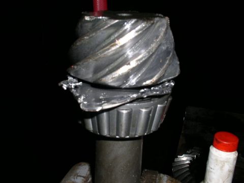 1979 Ford Bronco - Close-up of severely damaged differential gears, indicating a mechanical failure.