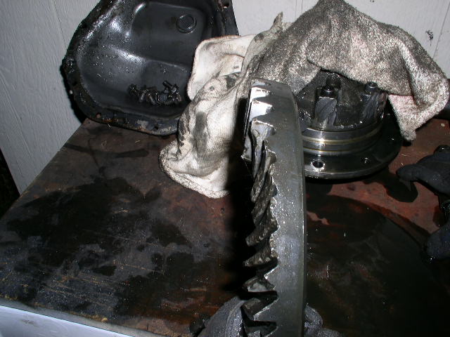 broken ring gear and differential assembly on a workbench