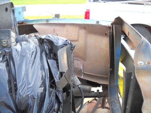 1954 Ford F-100 - Close-up view of a vehicle's engine bay, showing disassembled parts and signs of wear.