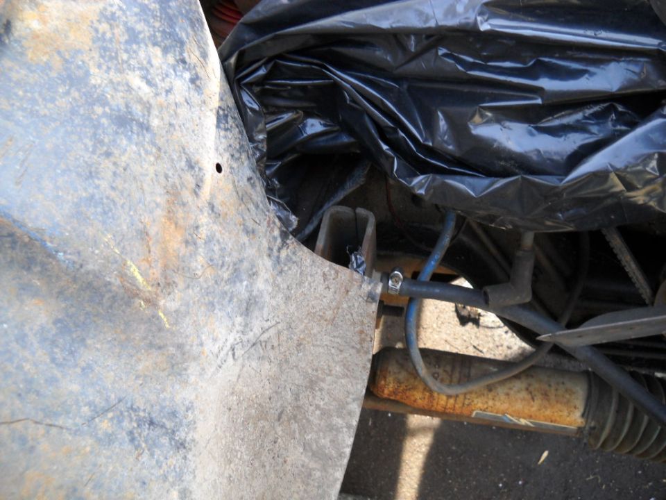 The little problem with the passenger side is an aftermarket steering stabilizer bracket. I just pried the inner fender panel out out to clear it for now.
