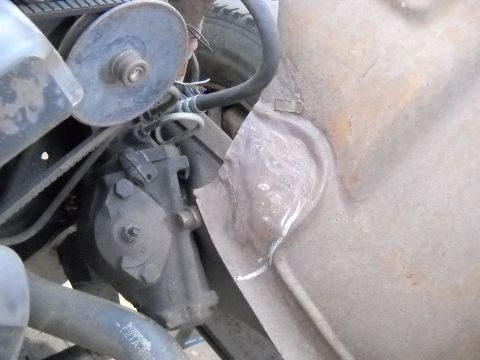 1954 Ford F-100 - The driverside had a little problem around the steering box. I hammered it out of the way for now. I'm going to have to cut it out and fabr…