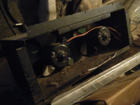 1981 Ford E350 - A close-up view of a dual fan assembly, possibly from a vehicle's HVAC system.