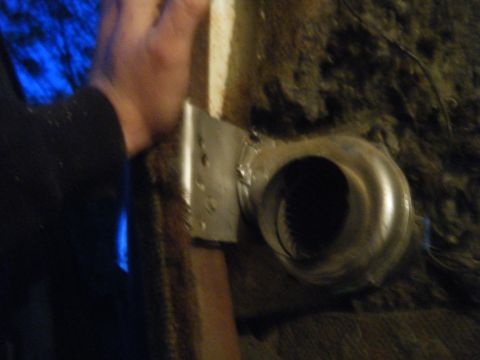 1981 Ford E350 - A close-up view of a metal component, likely from an engine, with a hand in the frame.