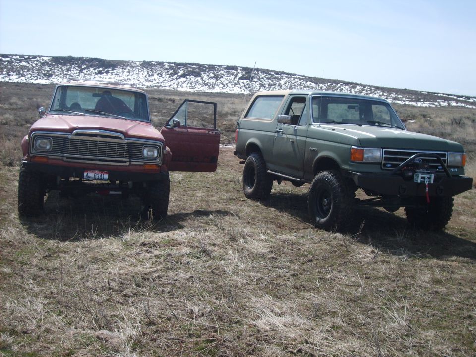 Green 1989 Ford Bronco with winch and aftermarket bumper