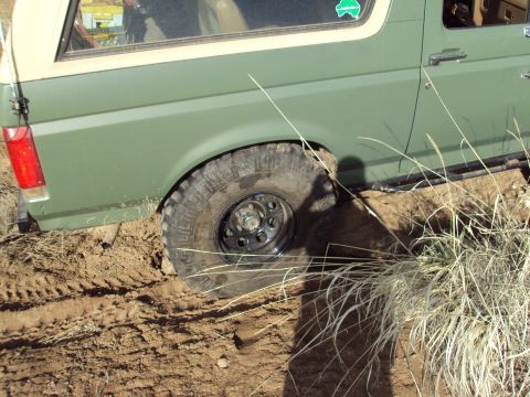 1989 Ford Bronco - This 1989 Ford Bronco is seen stuck in the mud with its off-road tires.