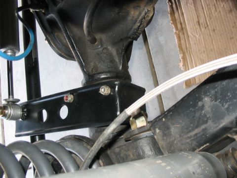 1995 Ford Bronco - Detail of a vehicle's rear suspension component, likely a trackbar bracket.