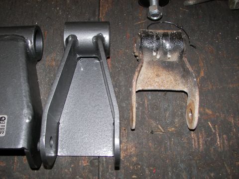 1990 Chevrolet Suburban - Comparison of a new suspension component with an old, rusted part.