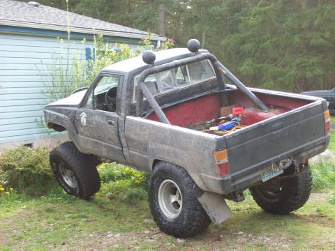 1985 Toyota Pickup/SR5 - This modified 1985 Toyota Pickup SR5 features a lifted suspension and a roll bar.