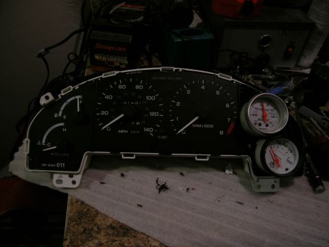 1995 Ford Probe - Instrument cluster with aftermarket gauges, likely for a custom build.