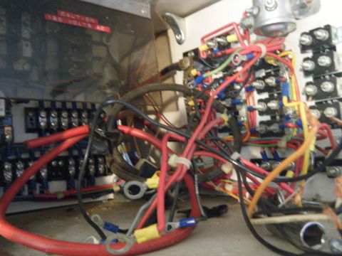 1981 Ford E350 - A complex electrical system with many wires and connections, possibly in a vehicle's fuse box.