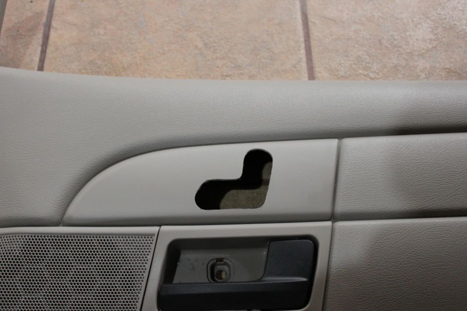 first time cutting out a powerseat door mounted powerseat switch hole in a P71 door panel. 

i used the RH LX door panel off my 2003 to get an idea of were to cut, from there i traced the LX door panel with paper and redrew it with black marker on the 2007 p71 panel. I drilled and shaved until it fit just right putting in the seat switch every so often to ensure proper fit, I planned for a slight 'ghetto' look but, it turned out really nice, take your time and fit the switch as much as you can to get a tight fit. i used liquid nails at the end on the back side to make sure it doesn't slip out of place even though it was a tight fit in the plastic.