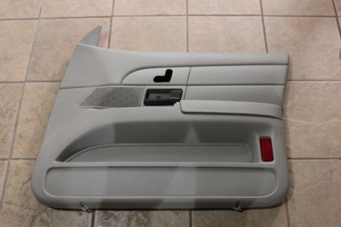 2007 Ford Crown Victoria - Interior door panel with seat adjustment controls and a speaker grille, likely from a Ford Crown Victoria.