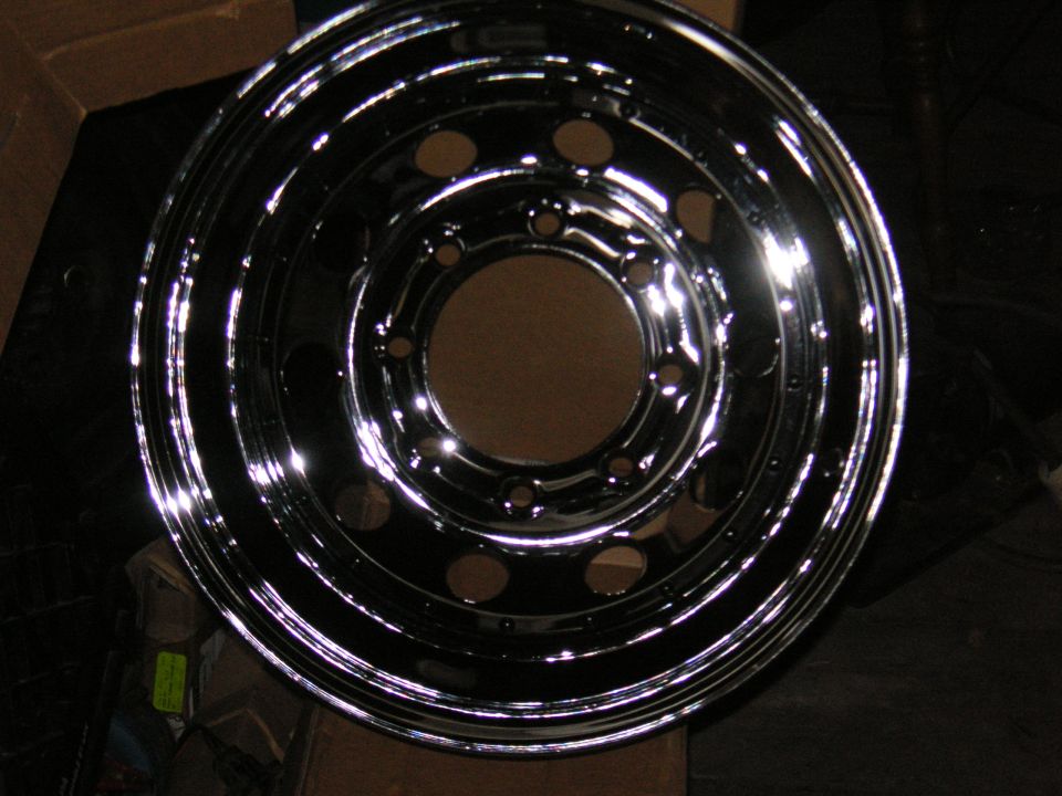 Shiny chrome wheel with multiple lug nut holes