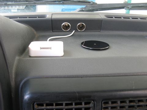 1991 Ford Festiva - Dashboard interior shows charging accessories and lighter sockets.
