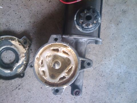 1993 Ford Bronco - A disassembled starter motor shows internal gears and grease, indicating wear or maintenance.