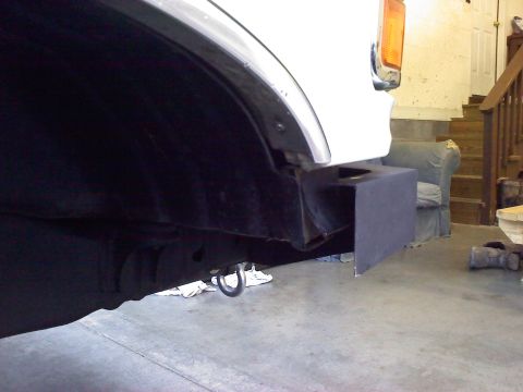 1996 Ford Bronco - Close-up of a vehicle's rear bumper corner and a visible tow hook.