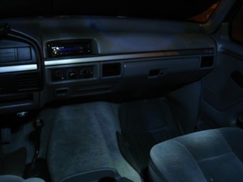 1996 Ford Bronco - Interior view of a 1996 Ford Bronco, highlighting the dashboard and seating area.