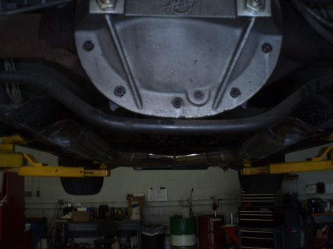 2002 Chevrolet Camaro - Underside view of a vehicle's rear differential and exhaust system, showing dual pipes.