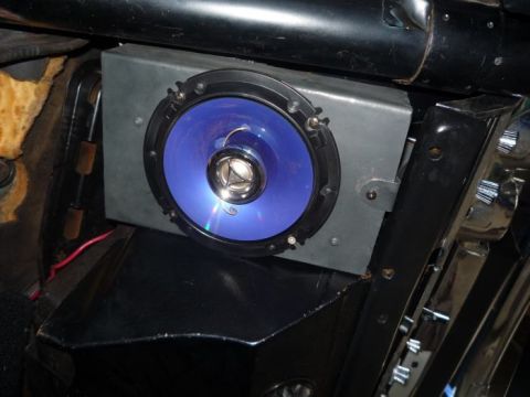 1964 Mercury Monterey - A blue-cone aftermarket speaker is installed in a car's interior, with visible wiring and mounting hardware.