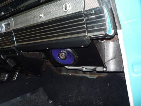 1964 Mercury Monterey - Close-up of the interior of a 1964 Mercury Monterey, showing a blue speaker installed under the dash.