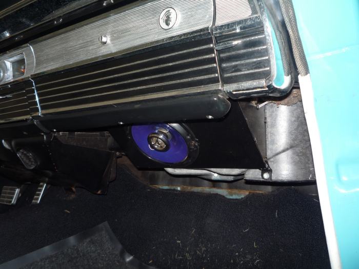1964 Mercury Monterey interior with a blue speaker mounted below the dashboard