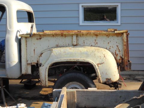 1954 Ford F-100 - Today I dug out the rear fenders and put them on. I put some blocks under the front of the box to raise it. And I put a 2"x2" under the rea…