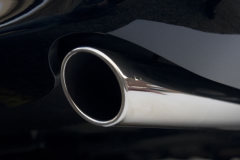 2003 Mercury Marauder - A close-up shot focuses on the polished chrome exhaust pipe of a vehicle.