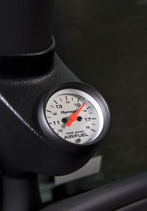 2003 Mercury Marauder - A close-up view of a Dynojet wide band air/fuel gauge with a red needle indicating a reading of 15.