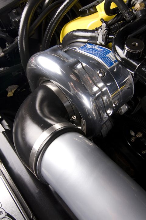 2003 Mercury Marauder - A chrome supercharger is visible with a blue label and black hoses in an engine bay.