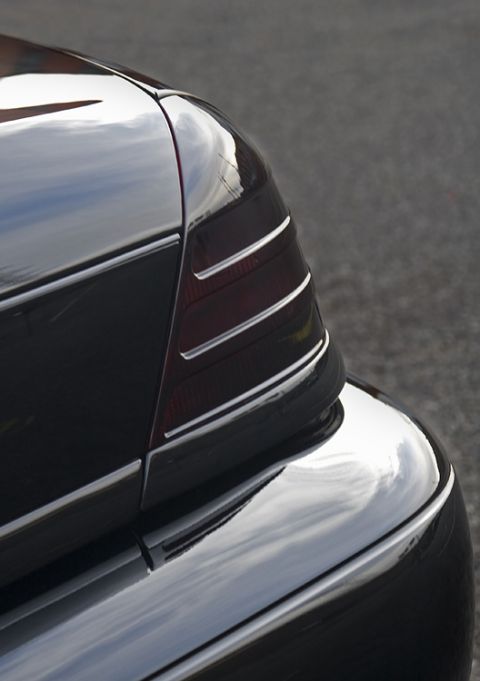 2003 Mercury Marauder - The chrome trim on this vehicle's rear bumper and taillight reflects the surroundings.